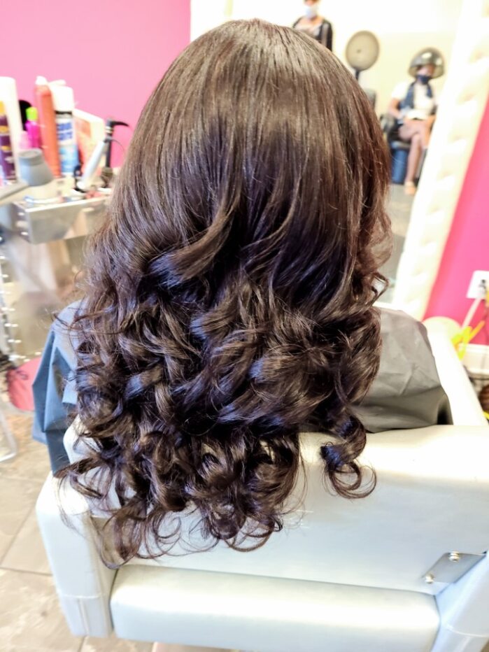 The back of a woman's head in a salon