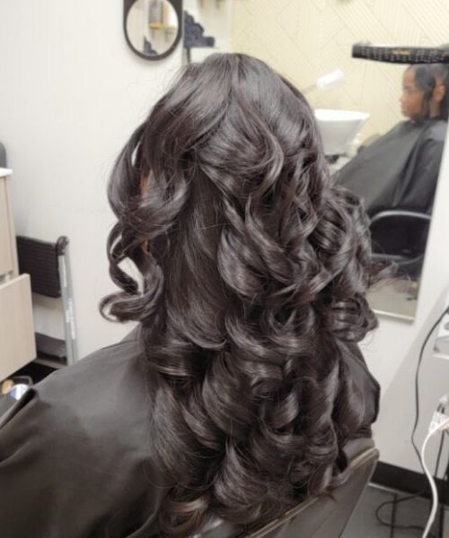 A woman getting her hair done in a salon