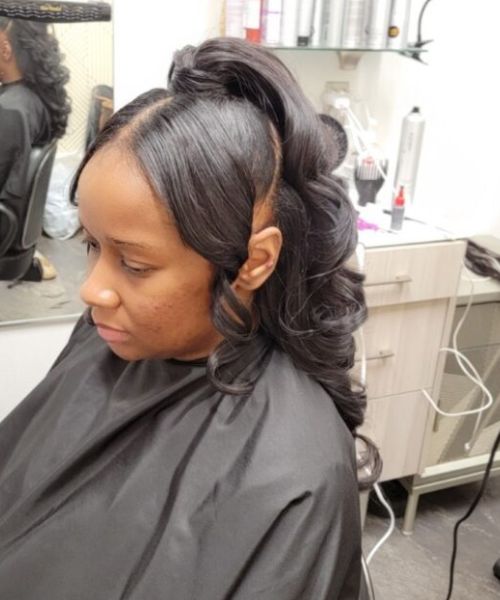 A woman getting her hair cut in a salon